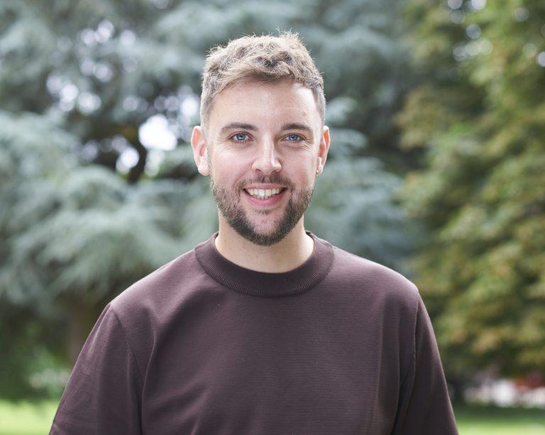 Professional headshot of Adam Kettle, Senior Bid Manager